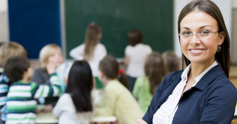 Photo of teacher smiling in classroom